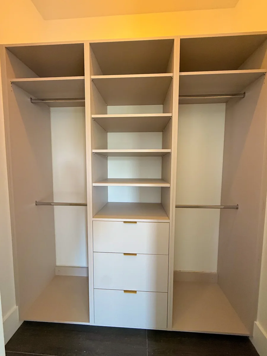 Walk-in closet with custom built-in shelving