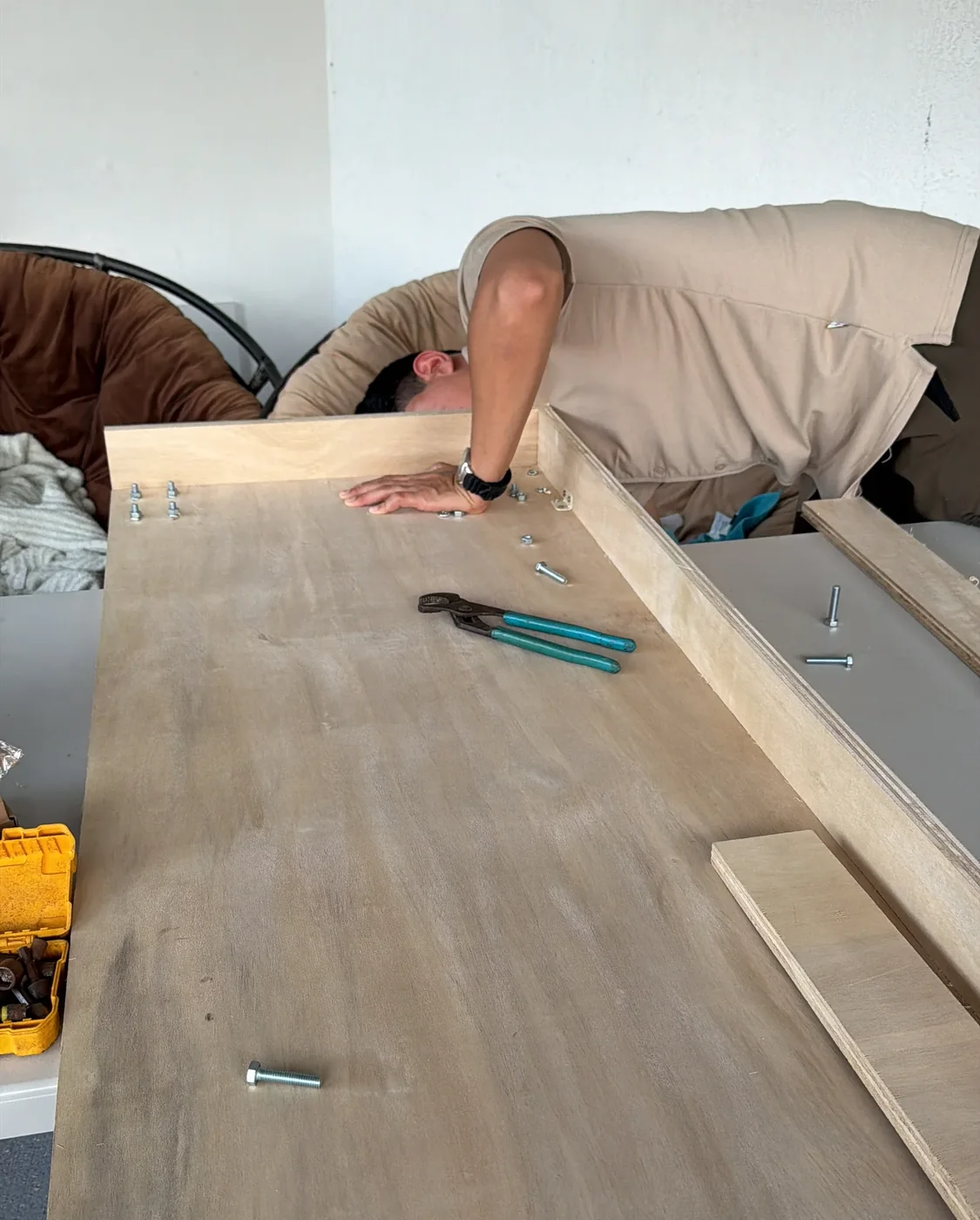 Installer leveling a countertop base on site