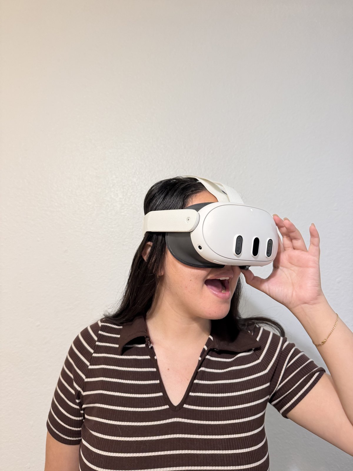 A D’Panim client wearing a VR headset, walking through her kitchen design before it is built