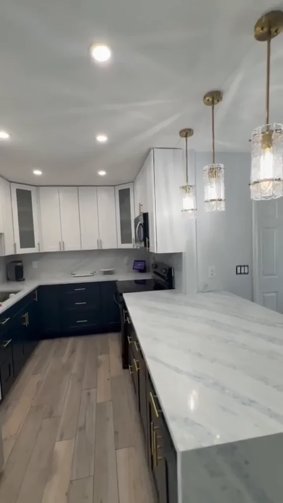 Waterfall island and navy lower cabinets